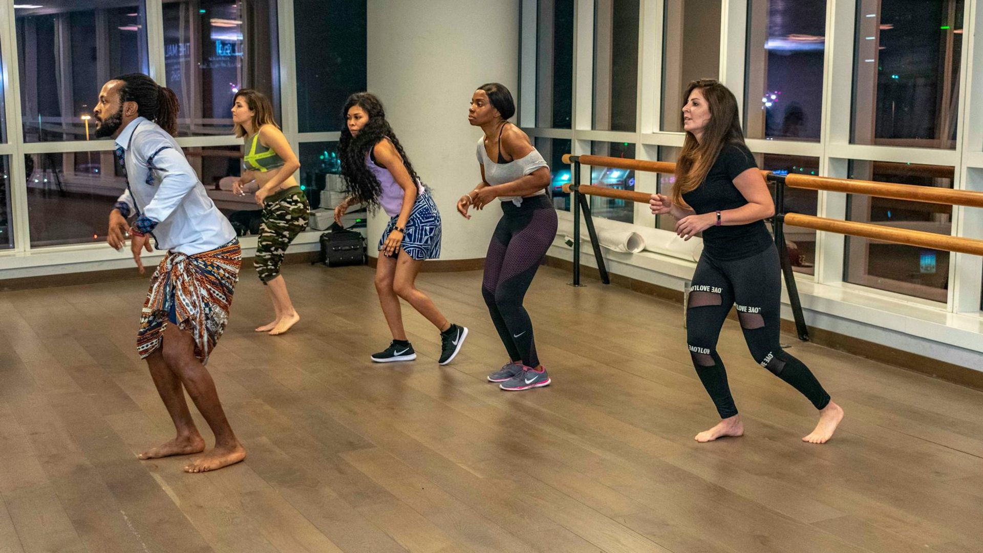 Person practicing cardio exercises in a bright minimalist studio