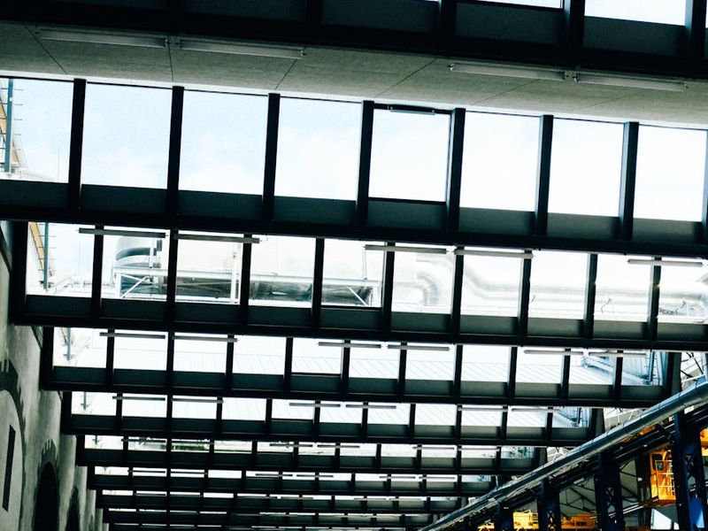 Wide shot of a modern fitness hall with large windows